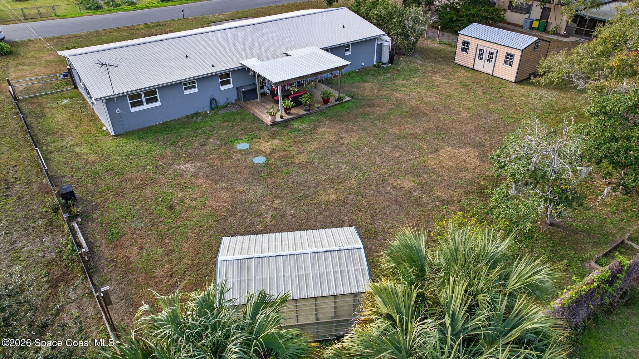 6033 Palm Street Mims, FL 32754 - Photo 35 of 44 a view of a backyard with plants and outdoor seating