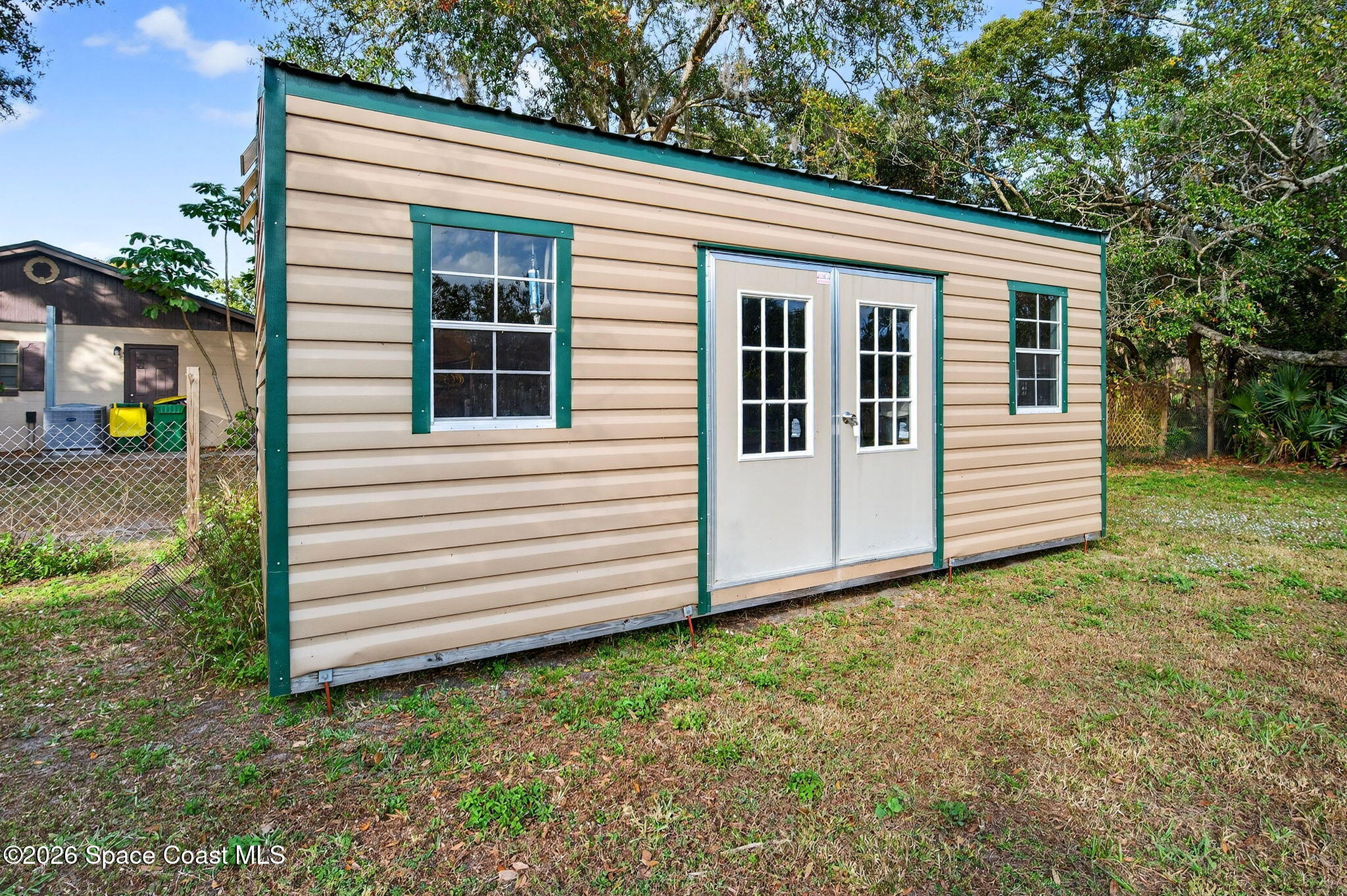 6033 Palm Street Mims, FL 32754 - Photo 36 of 44 a view of a house with a yard