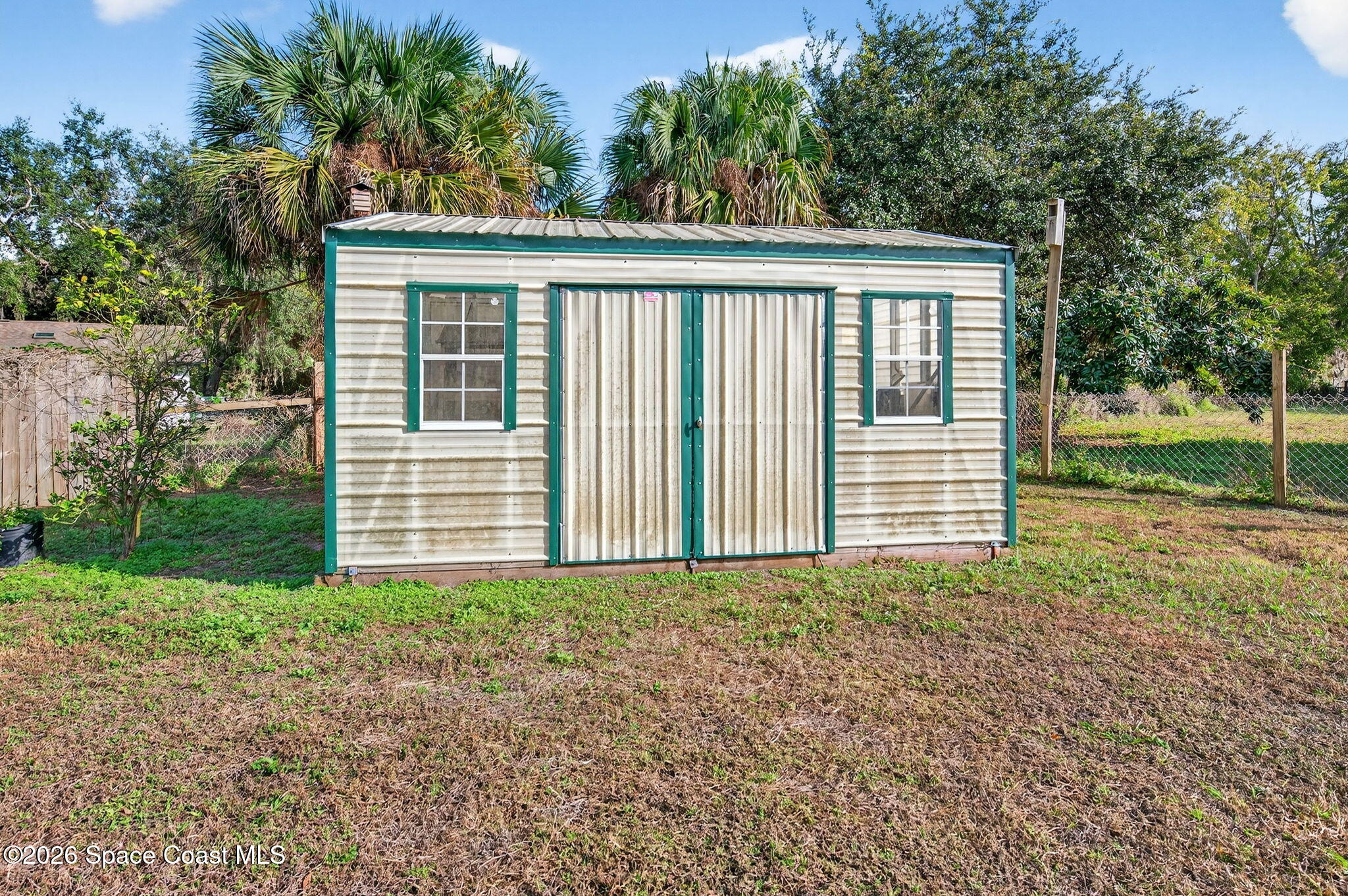 6033 Palm Street Mims, FL 32754 - Photo 37 of 44 a view of a house with backyard and garden