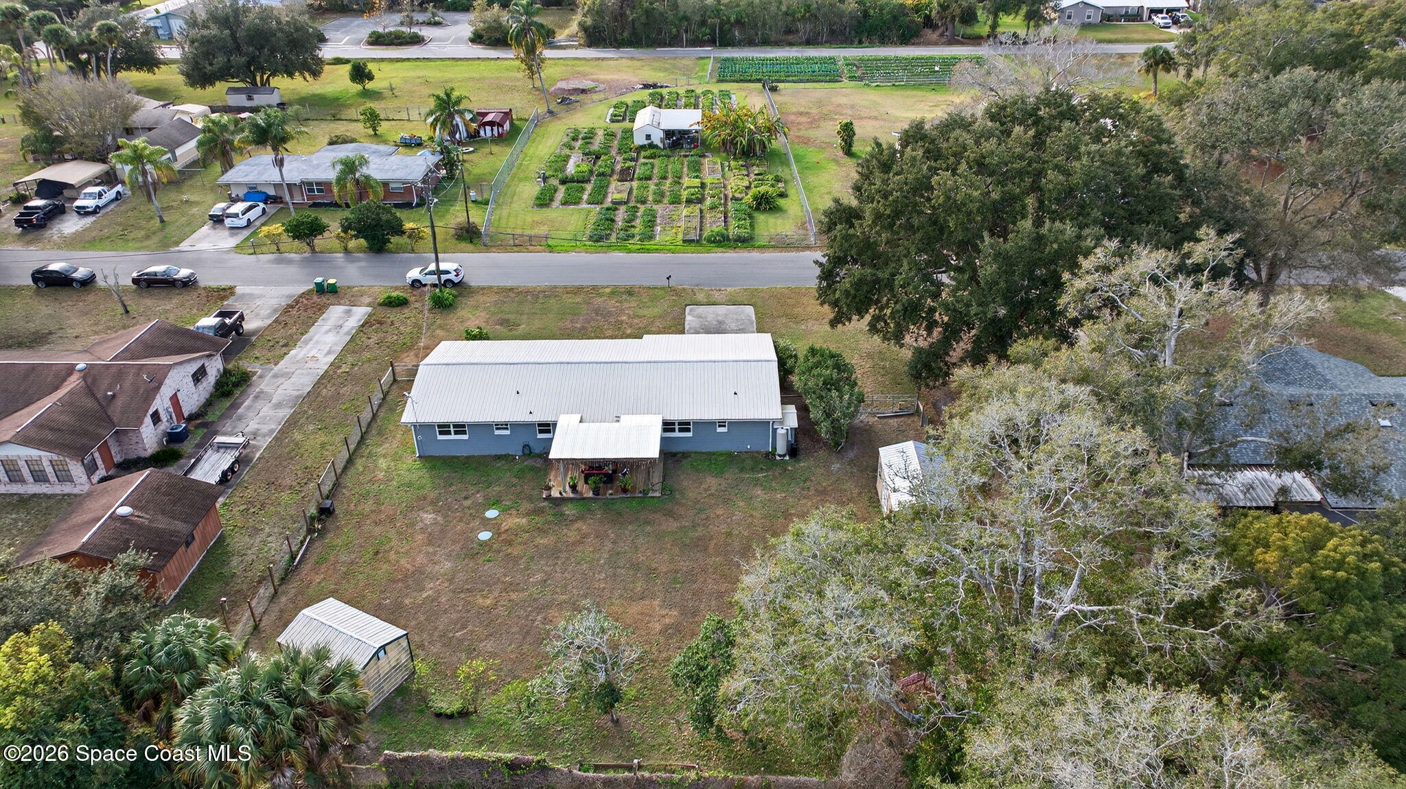 6033 Palm Street Mims, FL 32754 - Photo 43 of 44 an aerial view of a house with a yard basket ball court and outdoor seating