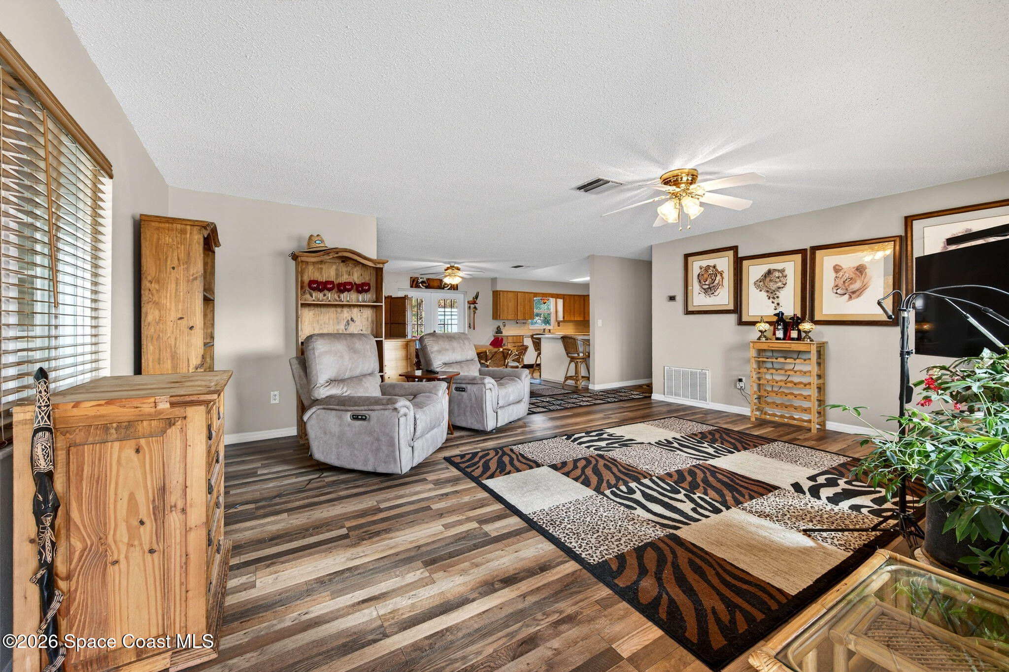 6033 Palm Street Mims, FL 32754 - Photo 6 of 44 a living room with furniture and wooden floor