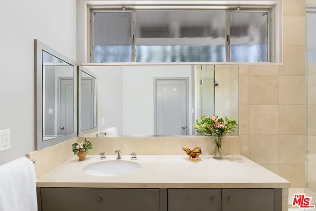 a bathroom with a sink and a mirror