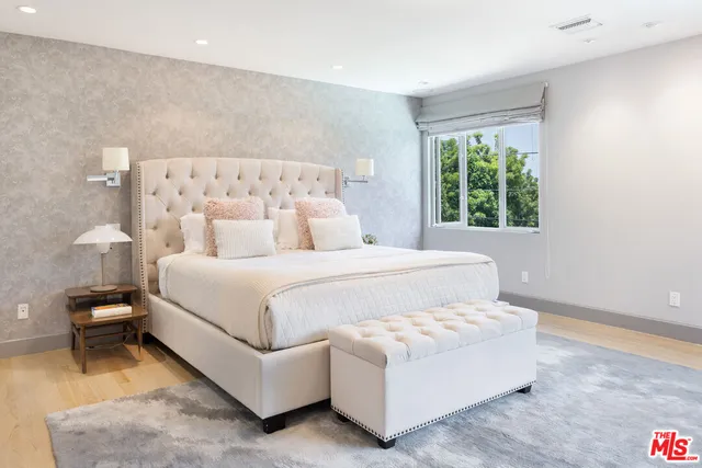 a bed room with a bed and a lamp