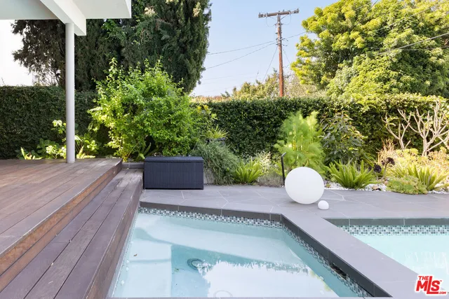 a view of a back yard and a chairs