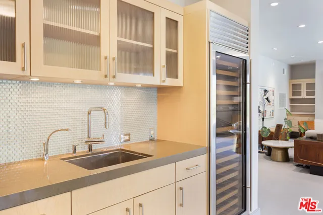 a kitchen with stainless steel appliances granite countertop a sink and cabinets