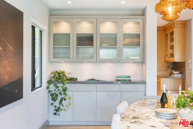 a kitchen with a sink and wooden cabinets