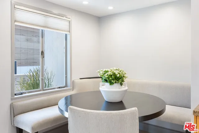 a view of a living room and a potted plant