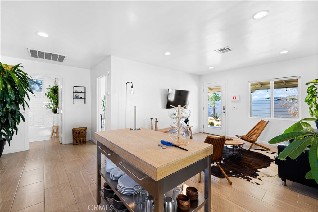 61879 Valley View Circle Joshua Tree, CA 92252 - Photo 8 of 63 a view of a workspace with furniture and wooden floor
