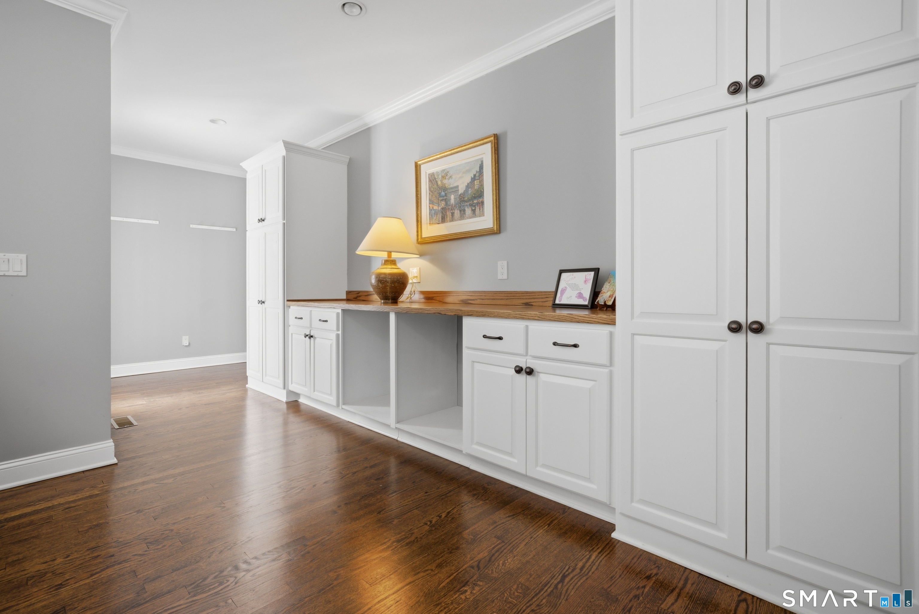 12 Dellwood Road Norwalk, CT 06850 - Photo 16 of 30 a room with white cabinets and wooden floor