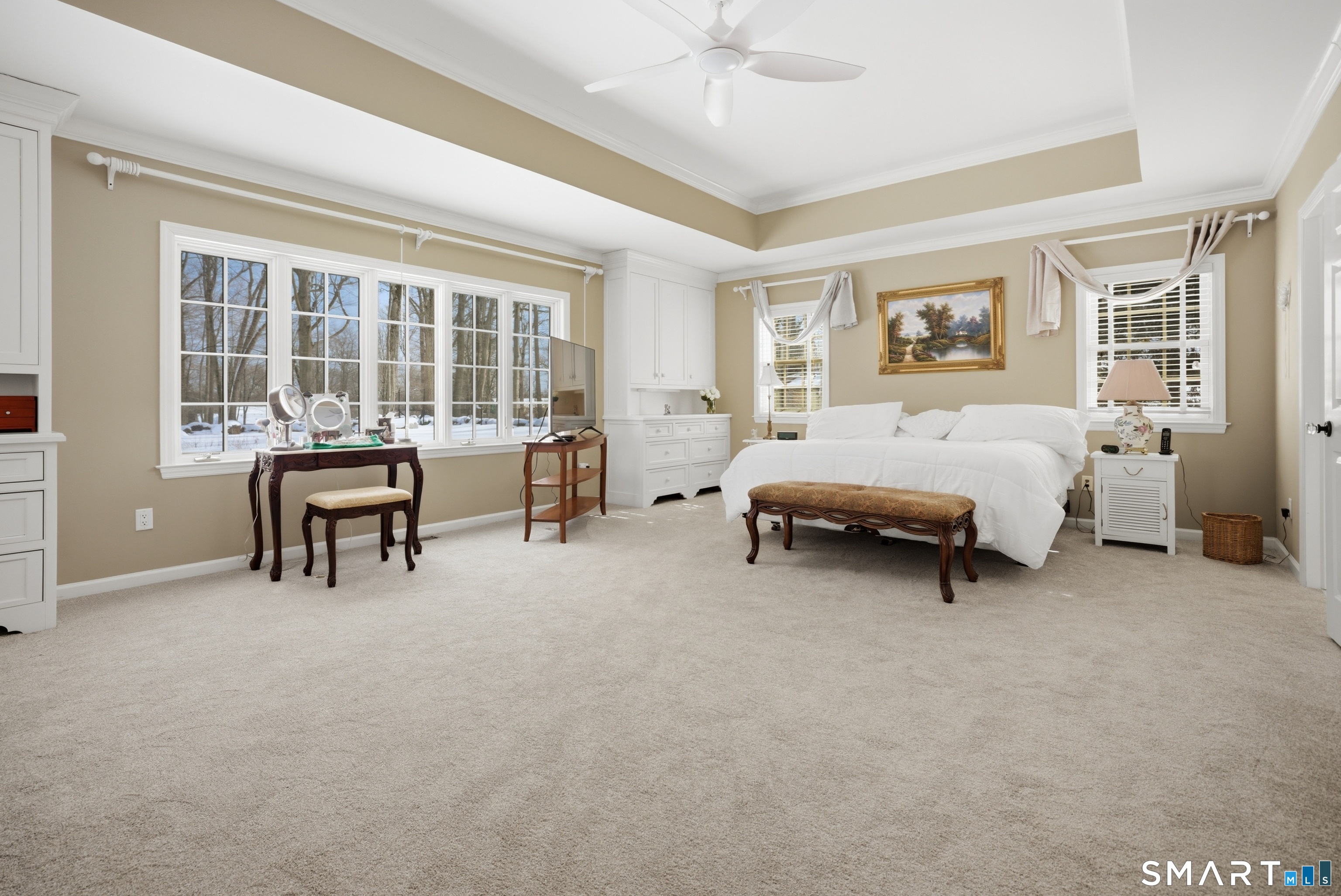 12 Dellwood Road Norwalk, CT 06850 - Photo 20 of 30 a spacious bedroom with a bed and a table in it