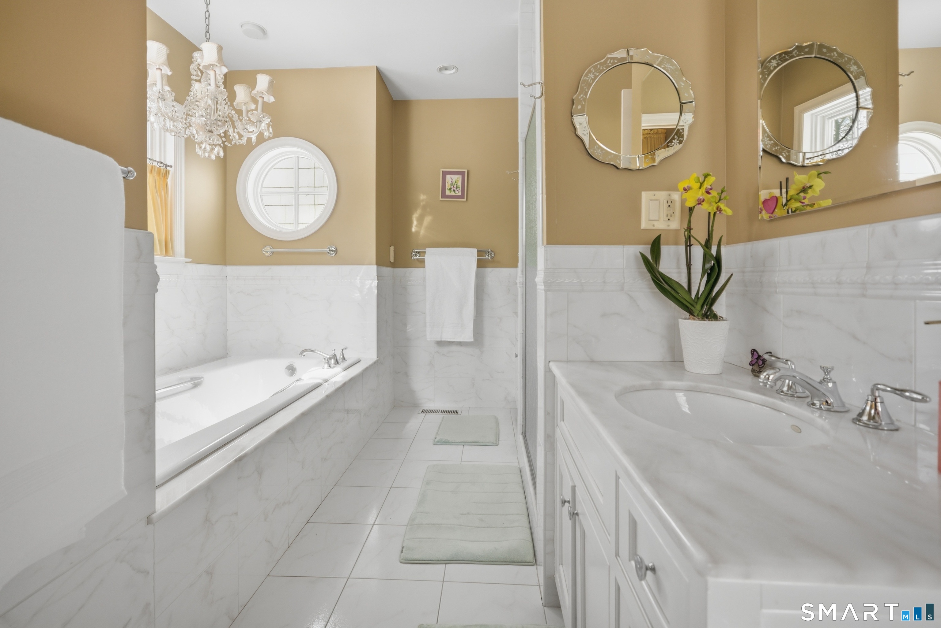 12 Dellwood Road Norwalk, CT 06850 - Photo 22 of 30 a bathroom with a bathtub a sink and a mirror