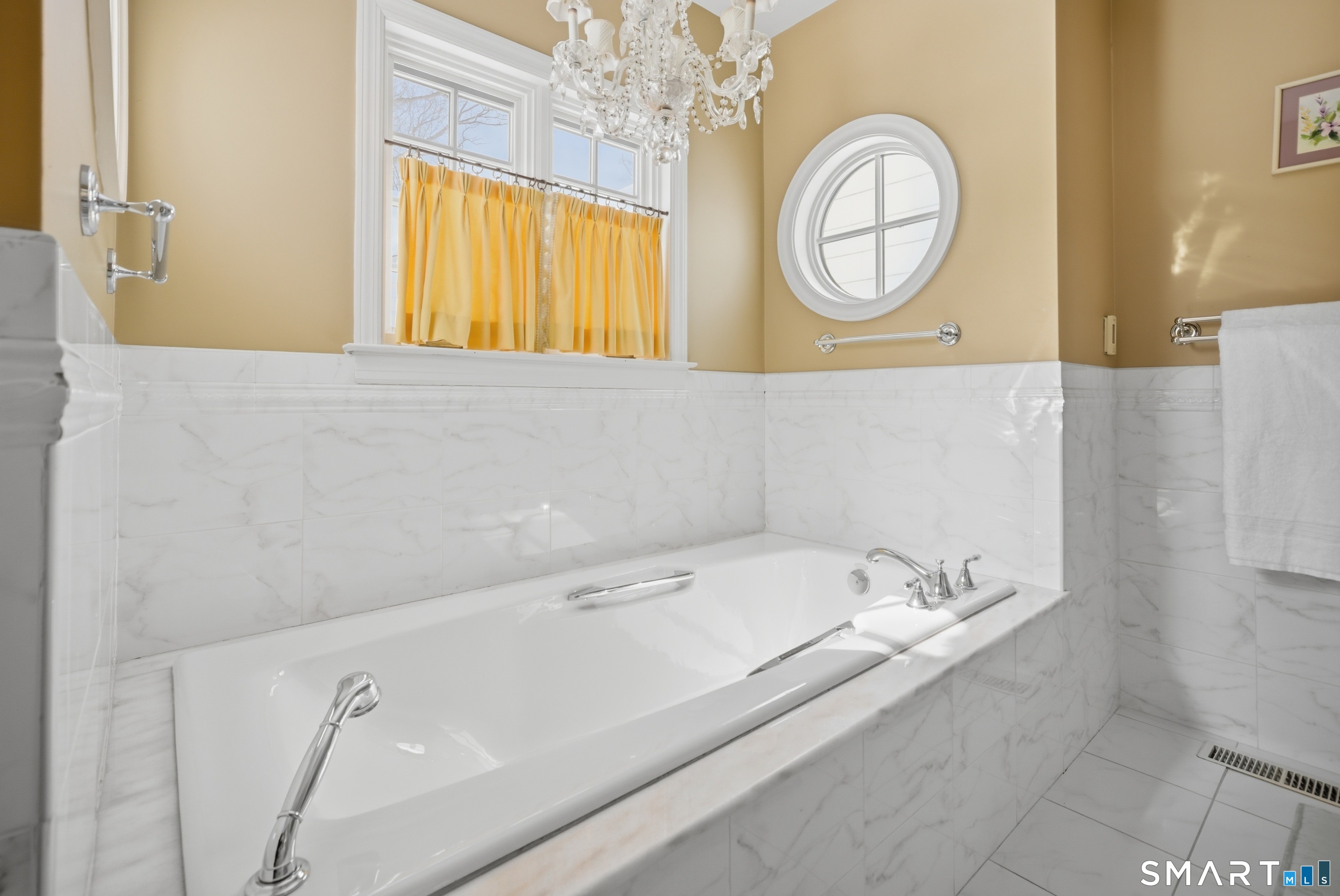 12 Dellwood Road Norwalk, CT 06850 - Photo 23 of 30 a bathroom with a bathtub a sink and a mirror