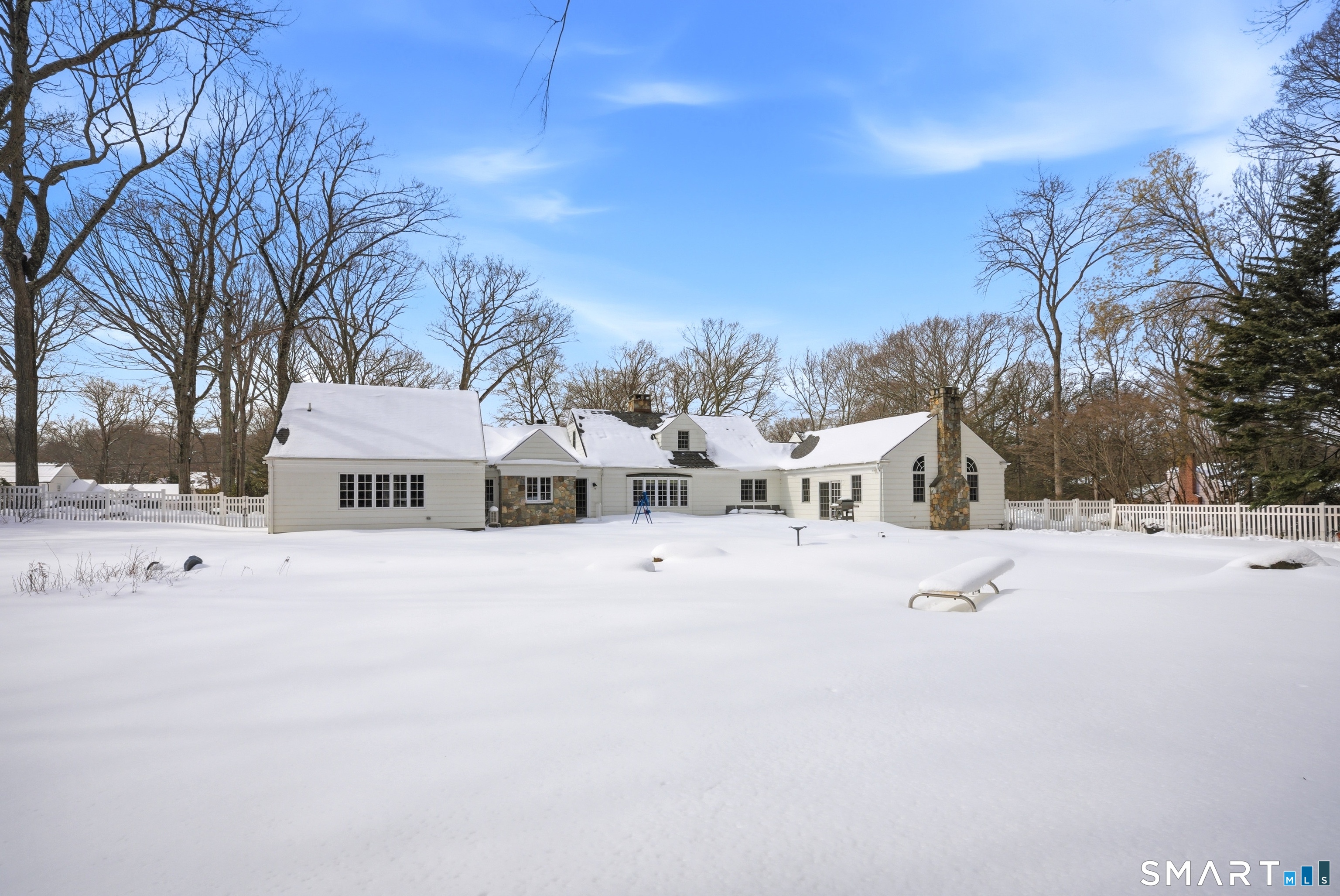 12 Dellwood Road Norwalk, CT 06850 - Photo 25 of 30 a view of a house with a snow in the yard