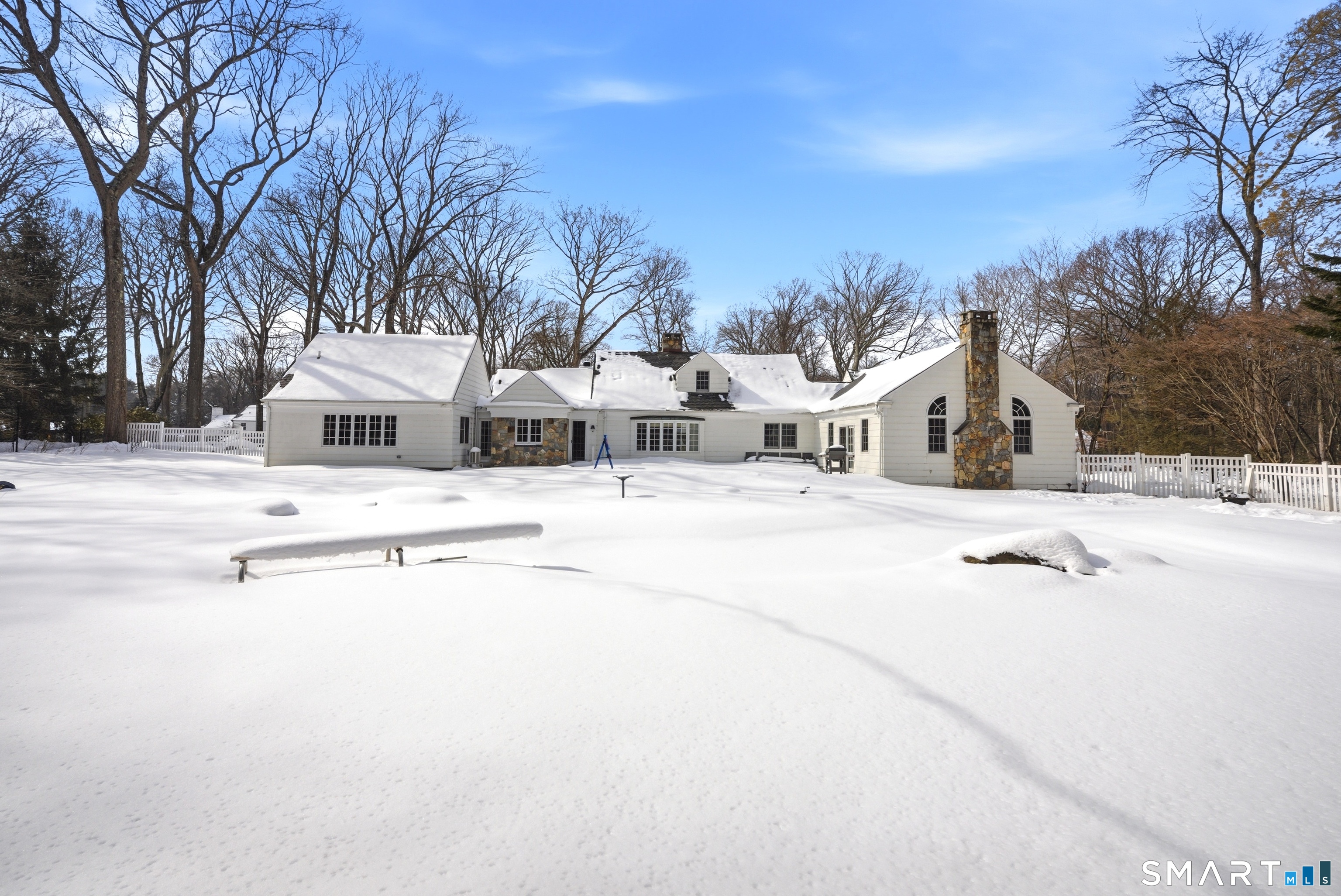 12 Dellwood Road Norwalk, CT 06850 - Photo 26 of 30 a view of white house with a yard and covered with snow