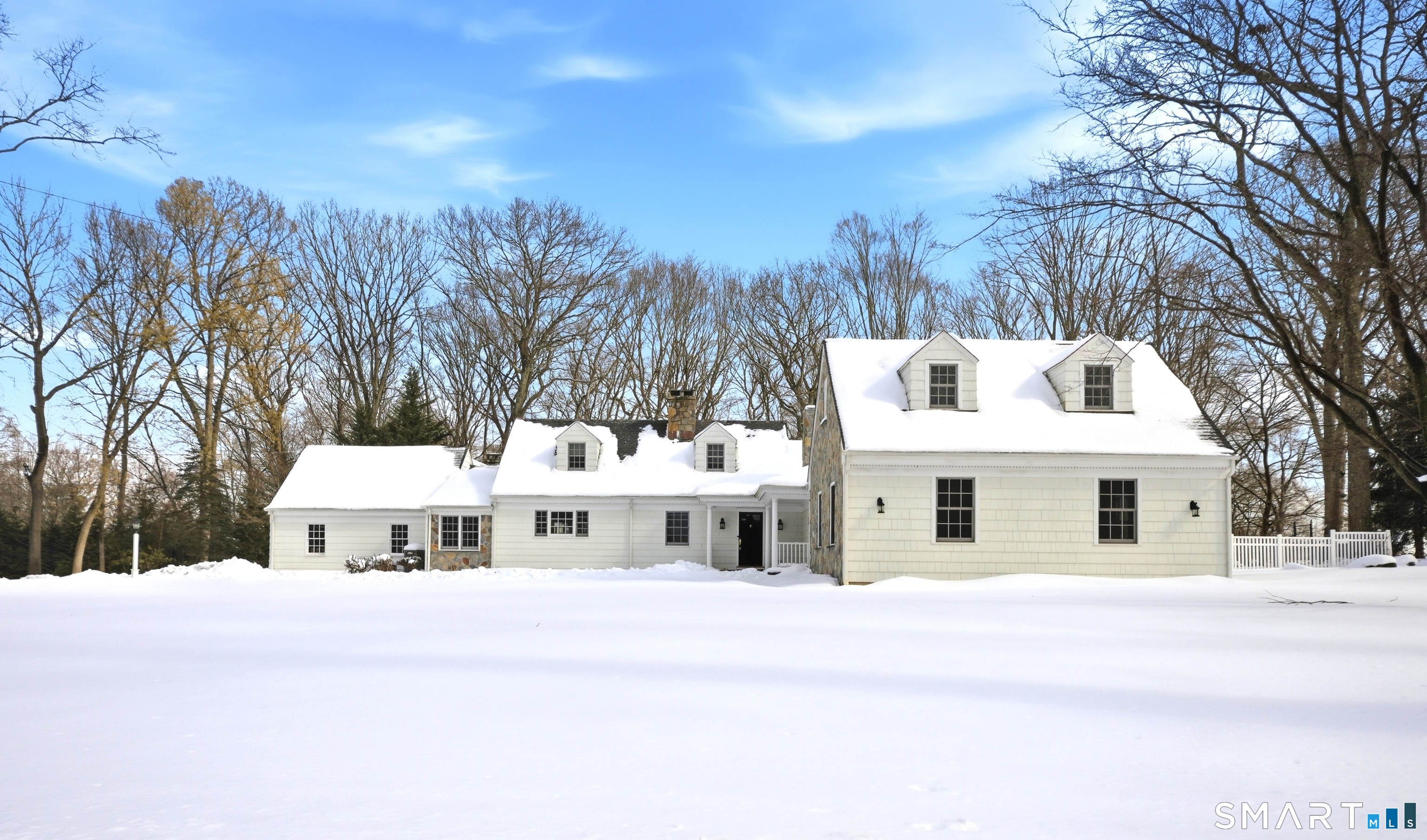 12 Dellwood Road Norwalk, CT 06850 - Photo 27 of 30 a white house with a large tree in front of it