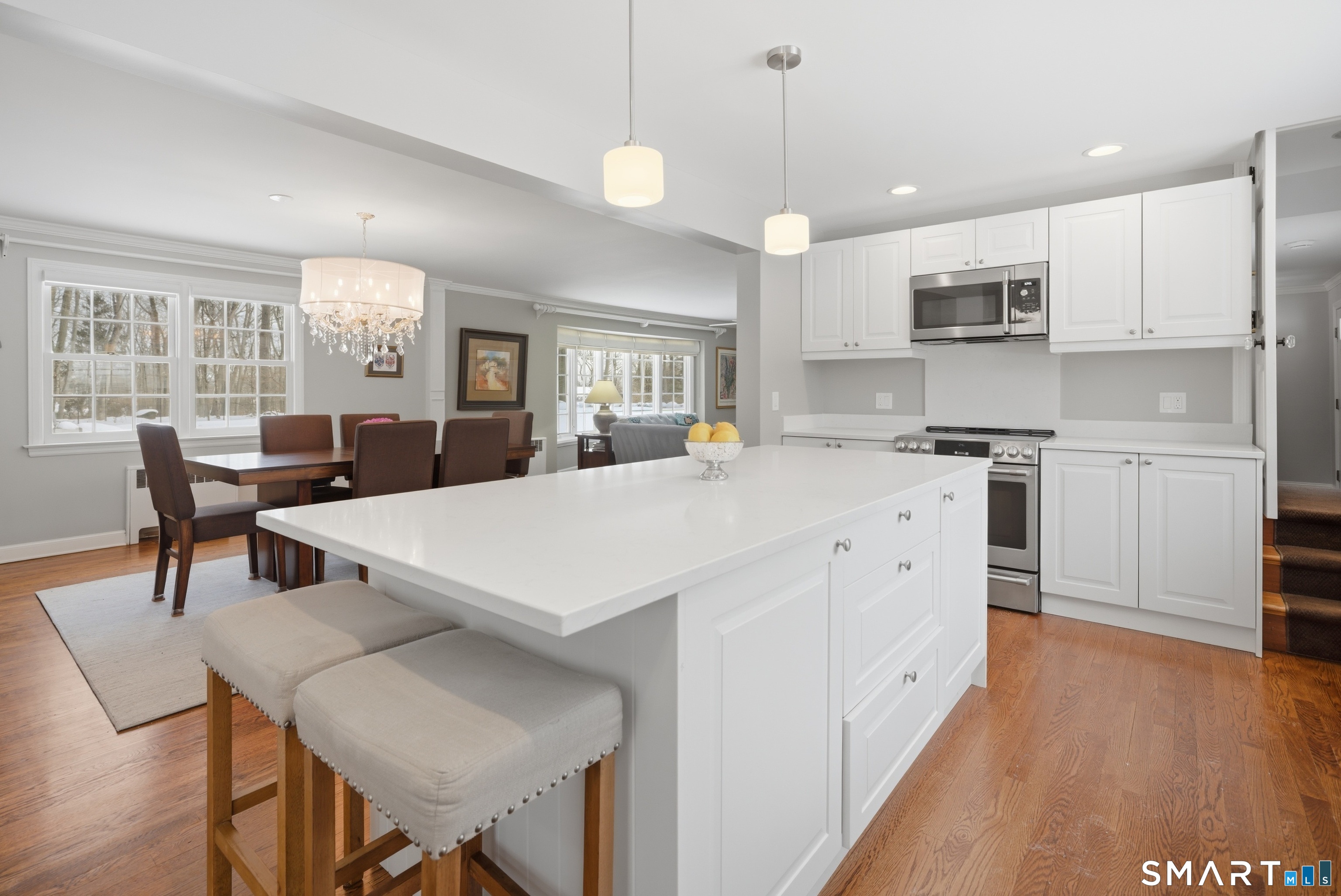 12 Dellwood Road Norwalk, CT 06850 - Photo 5 of 30 a large kitchen with kitchen island a island a sink a stove and a center island