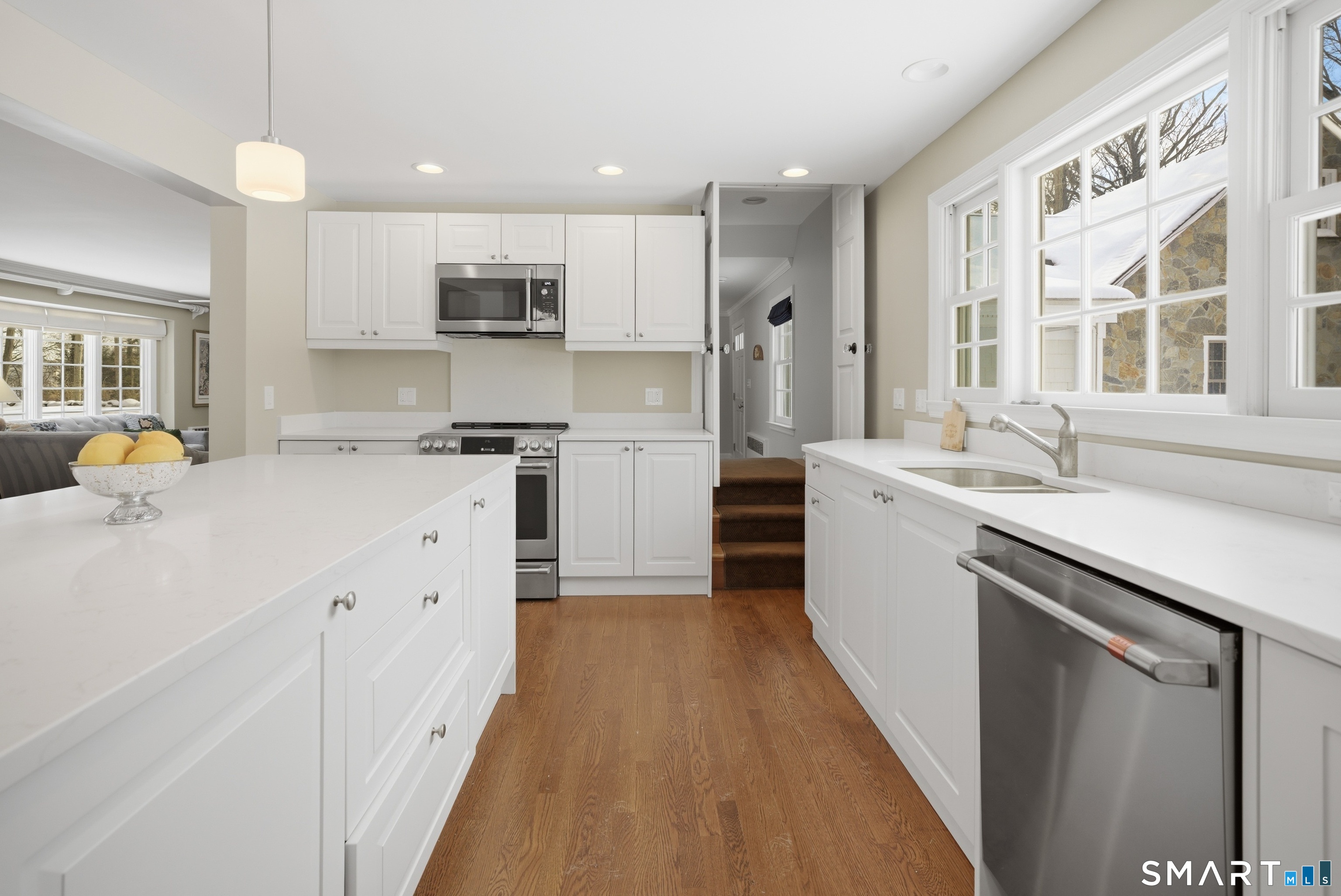 12 Dellwood Road Norwalk, CT 06850 - Photo 7 of 30 a kitchen with stainless steel appliances a refrigerator sink and cabinets