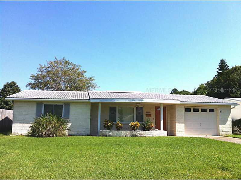 4625 Chamber Court New Port Richey, FL 34652 - Photo 1 of 1 a front view of a house with a garden and porch