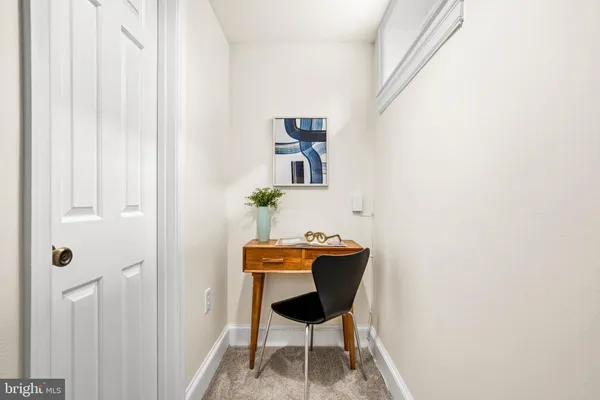 a work room with furniture and wooden floor
