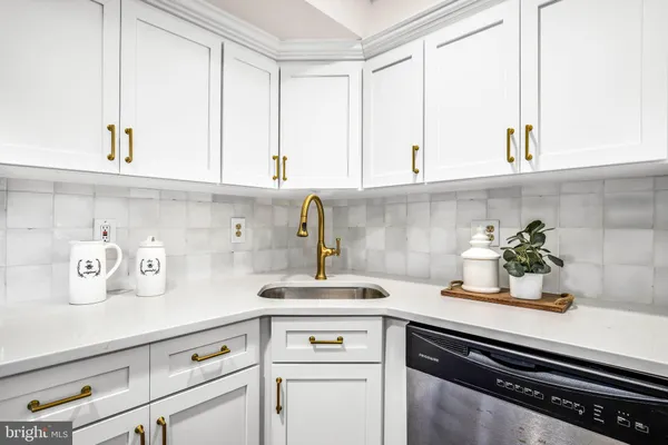 a kitchen with a sink and cabinets
