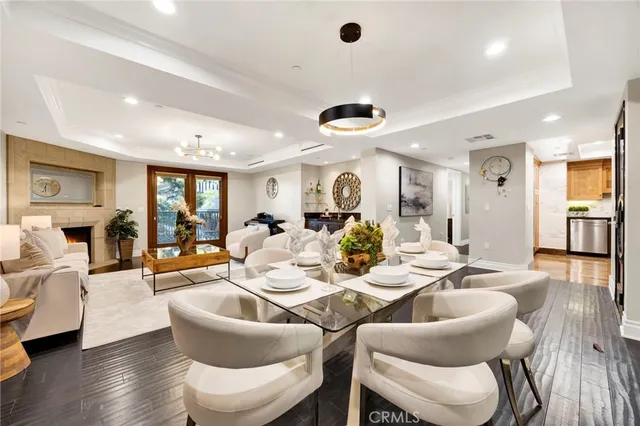 a dining room with furniture and wooden floor