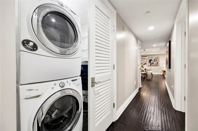 a view of a hallway with washer and dryer