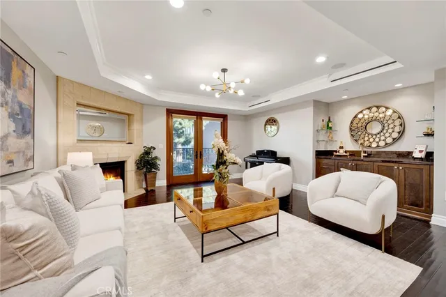 a living room with furniture fireplace and window