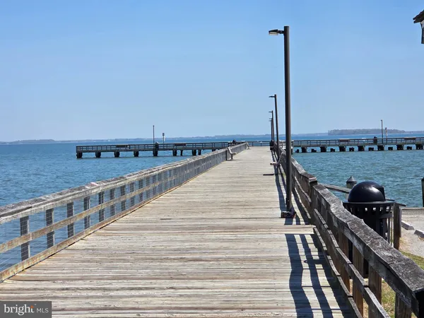 a view of a balcony with two chairs