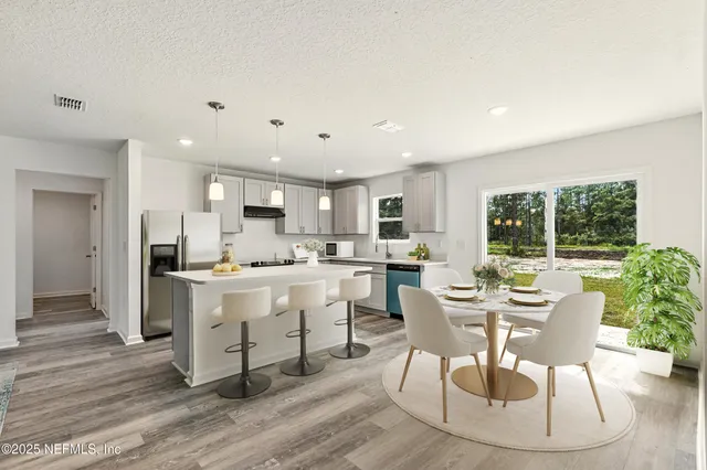 a view of a house with backyard and garden