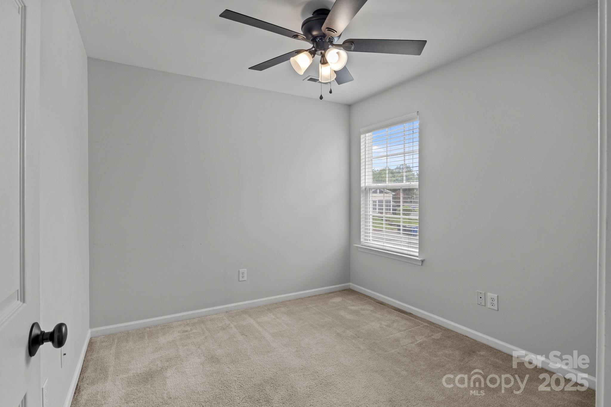 17744 Trolley Crossing Way Cornelius, NC 28031 - Photo 17 of 27 a view of an empty room with a window