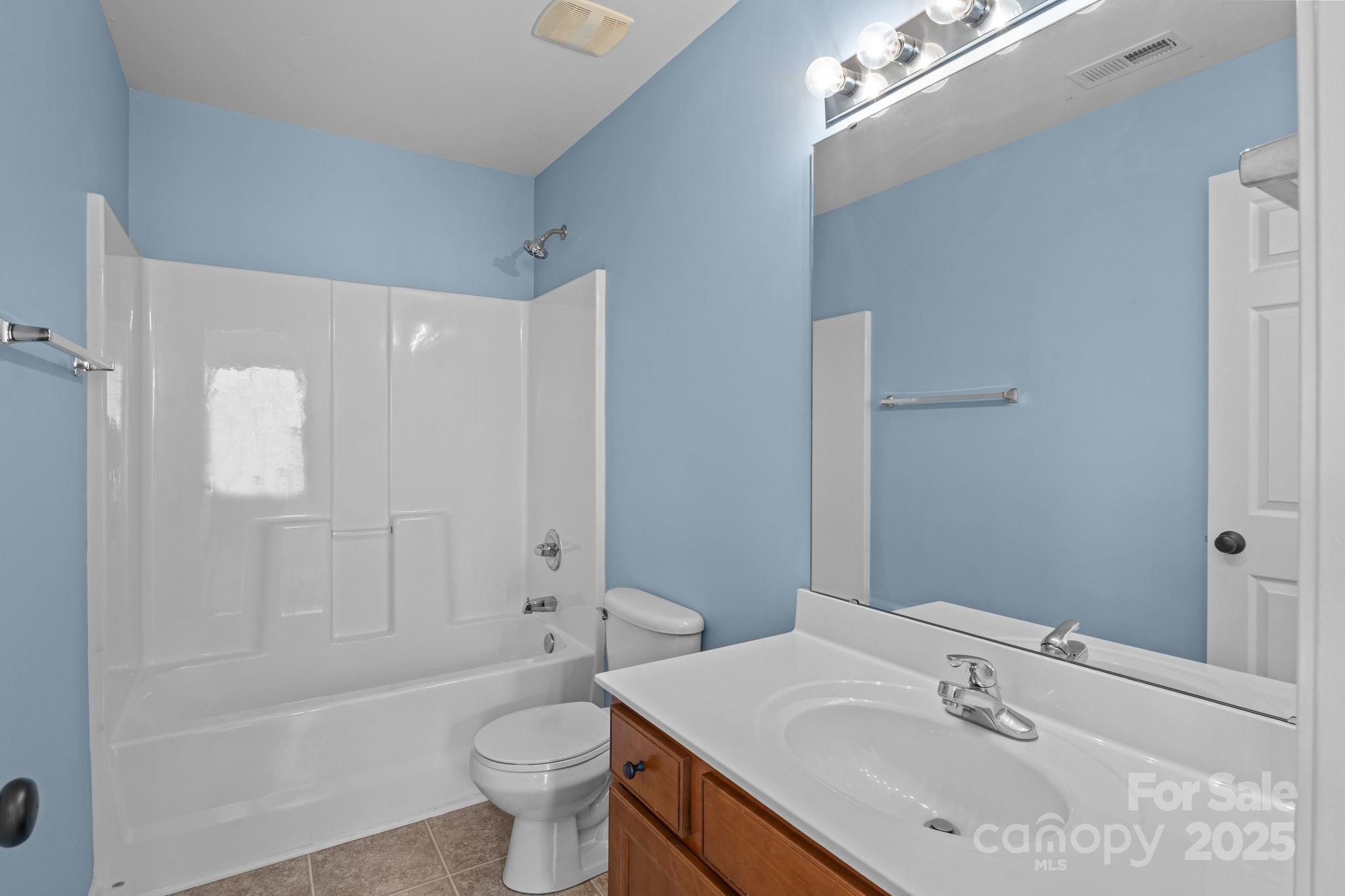17744 Trolley Crossing Way Cornelius, NC 28031 - Photo 18 of 27 a bathroom with a sink a toilet and shower