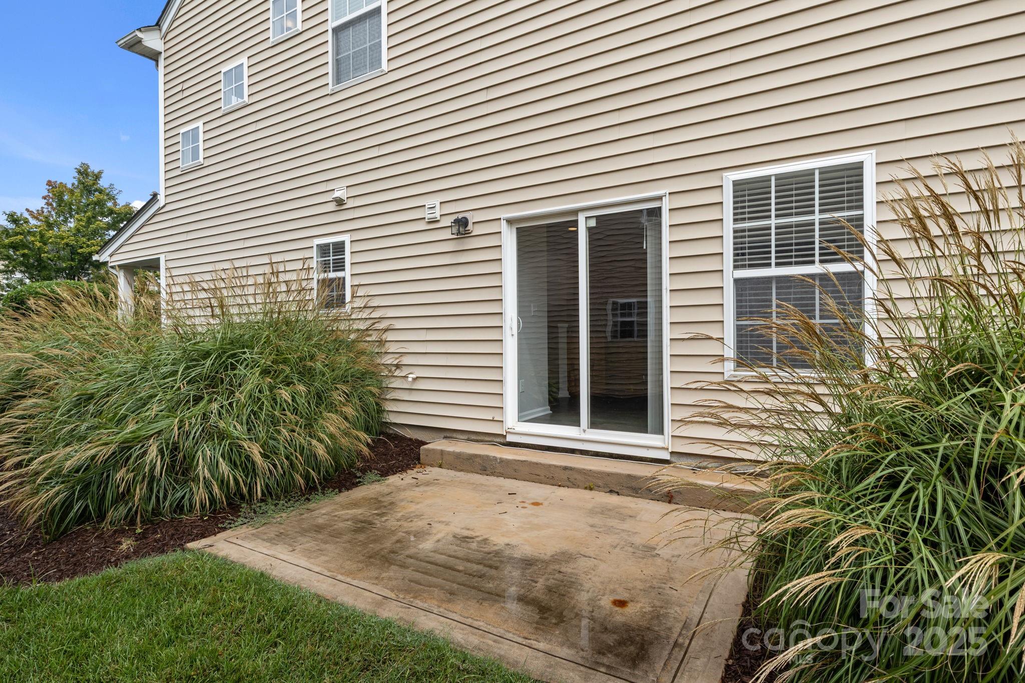 17744 Trolley Crossing Way Cornelius, NC 28031 - Photo 20 of 27 a view of a backyard with plants