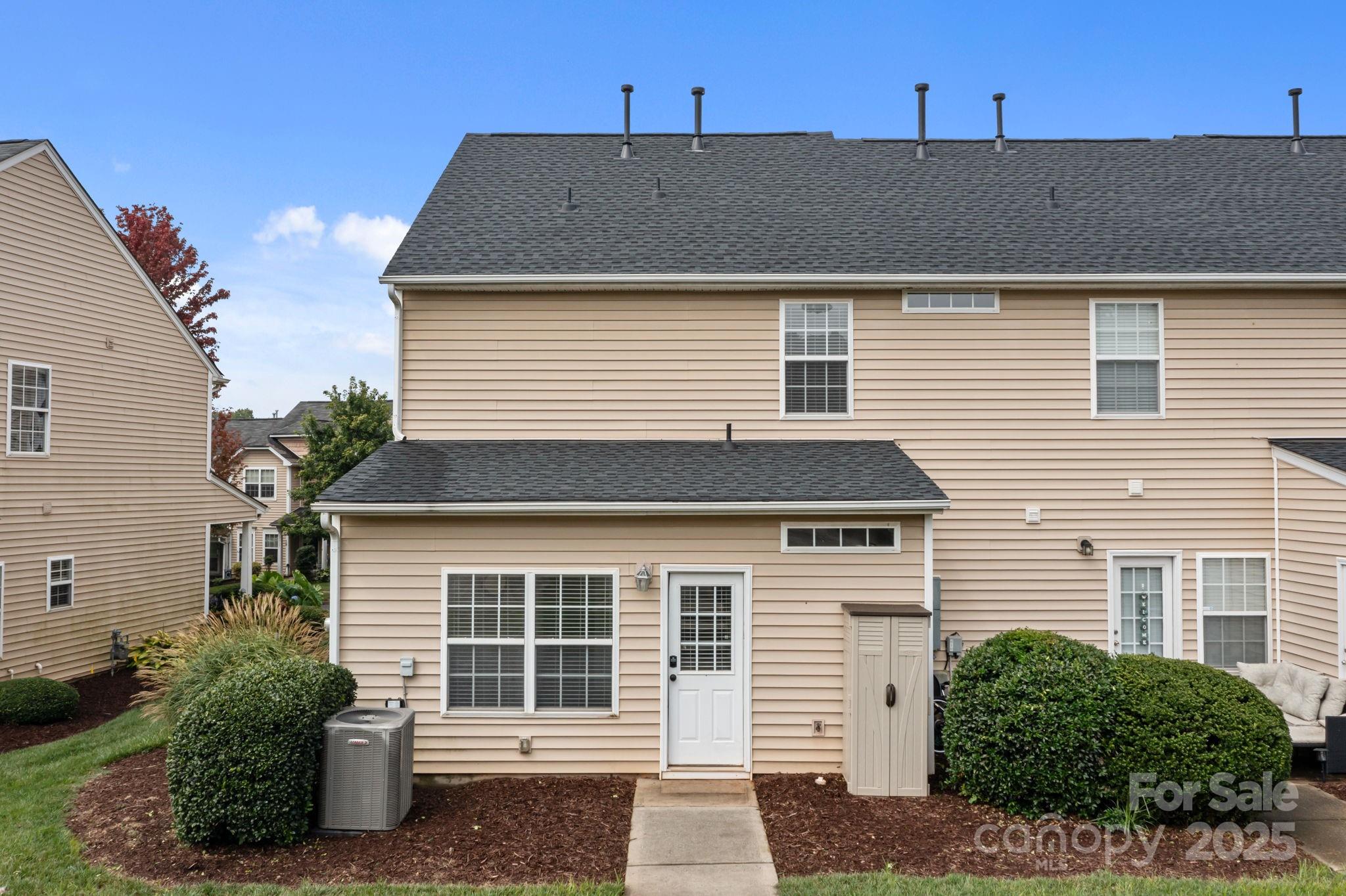 17744 Trolley Crossing Way Cornelius, NC 28031 - Photo 21 of 27 a front view of a house with a yard