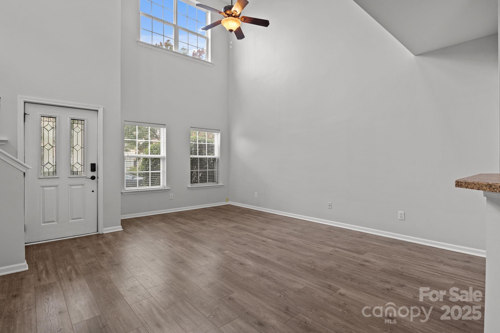 17744 Trolley Crossing Way Cornelius, NC 28031 - Photo 4 of 27 wooden floor in an empty room