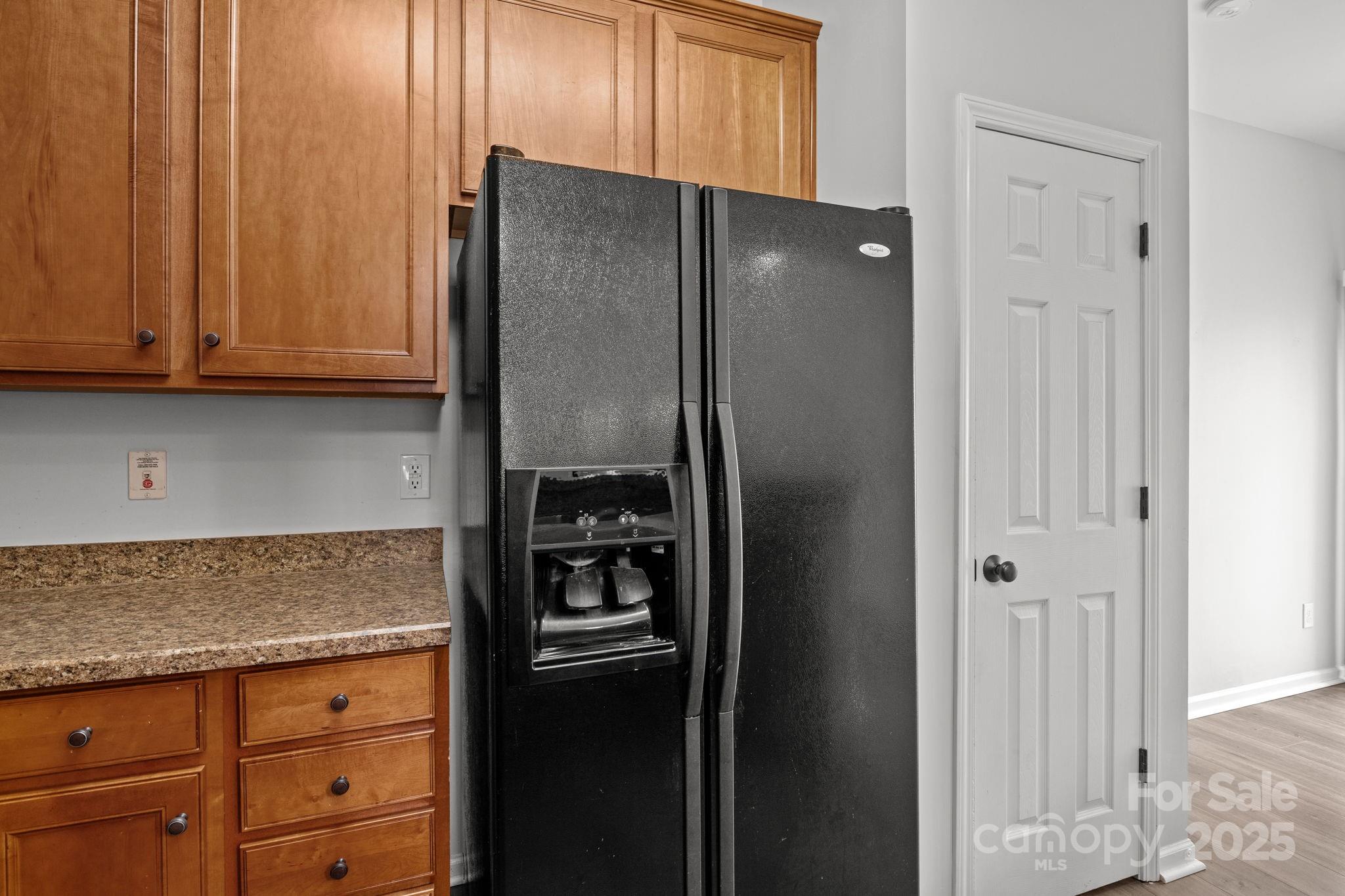 17744 Trolley Crossing Way Cornelius, NC 28031 - Photo 10 of 27 a kitchen with metallic refrigerator freezer and a dishwasher