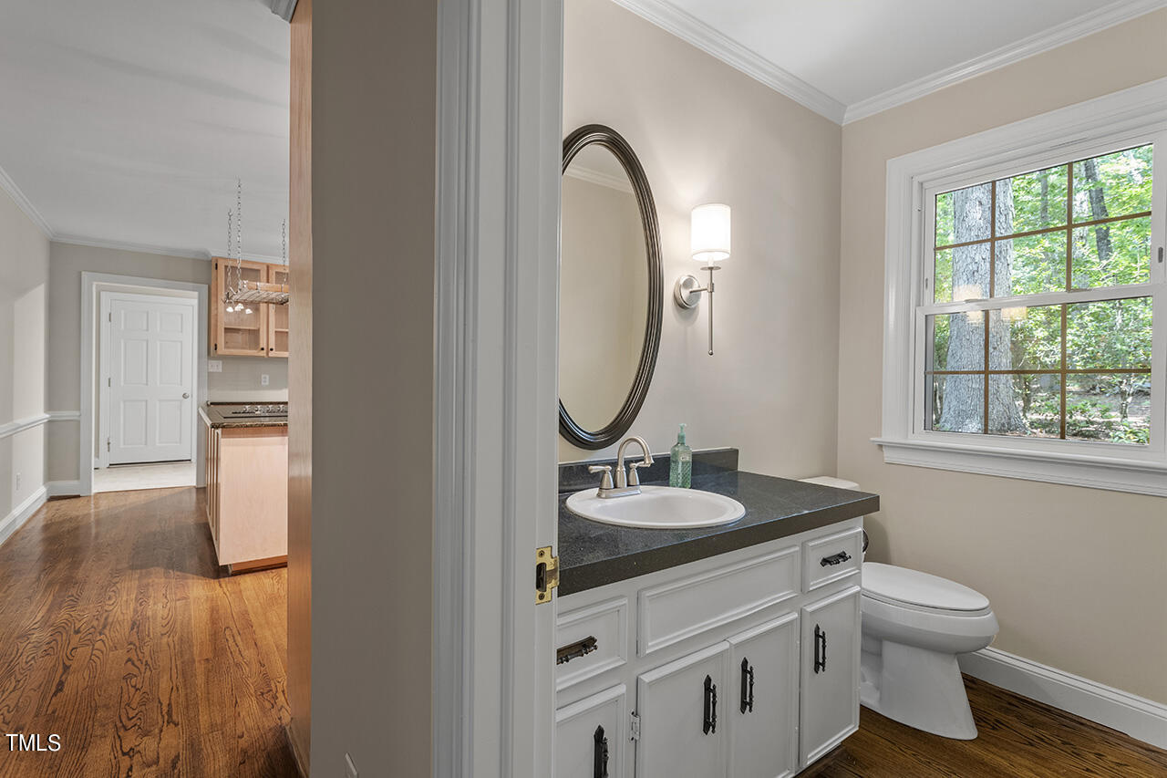 5200 Smallwood Court Raleigh, NC 27613 - Photo 12 of 38 Half bathroom in hallway.