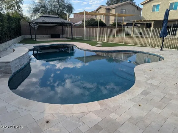 a view of outdoor space with swimming pool