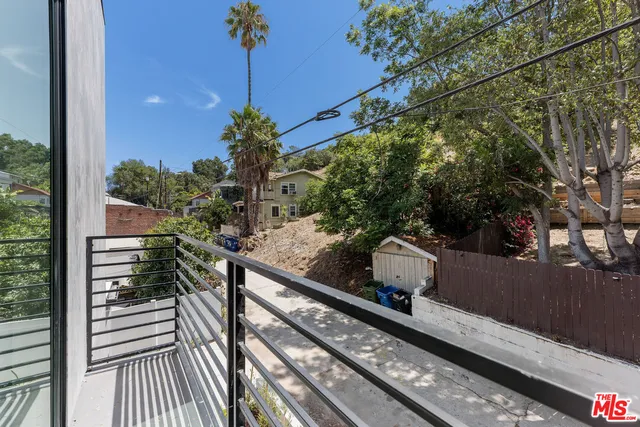 a view of a balcony with wooden floor