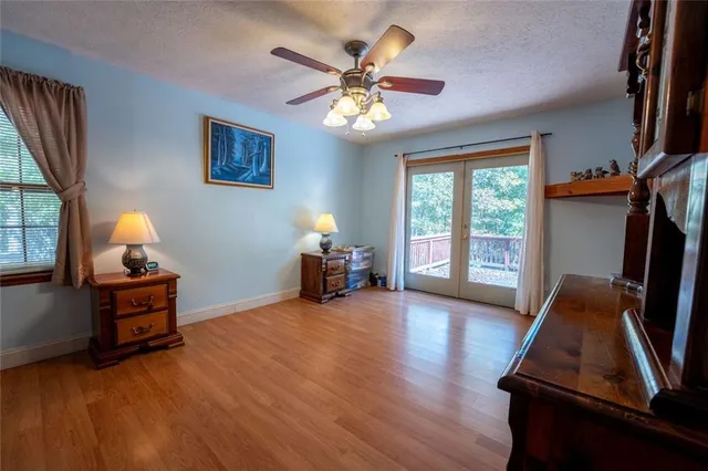 a view of room with window and wooden floor