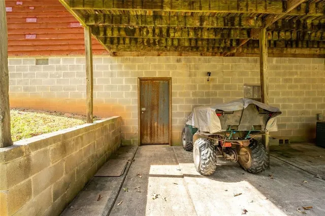 a bathroom with mirror and shower