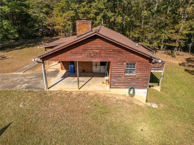 a view of backyard with a garden and entertaining space
