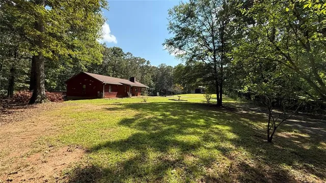 a house with swimming pool in front of it