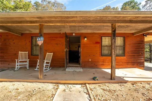 a view of a dinning room with table and chairs