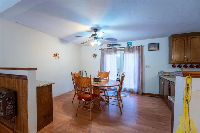a view of a dining room with furniture and chandelier