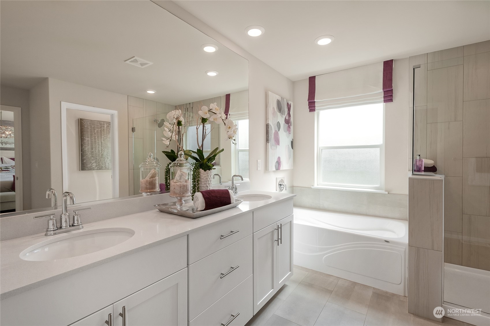 4015 233rd Street Southeast, Unit 8 Bothell, WA 98021 - Photo 16 of 18 a bathroom with a double vanity sink window and a bathtub