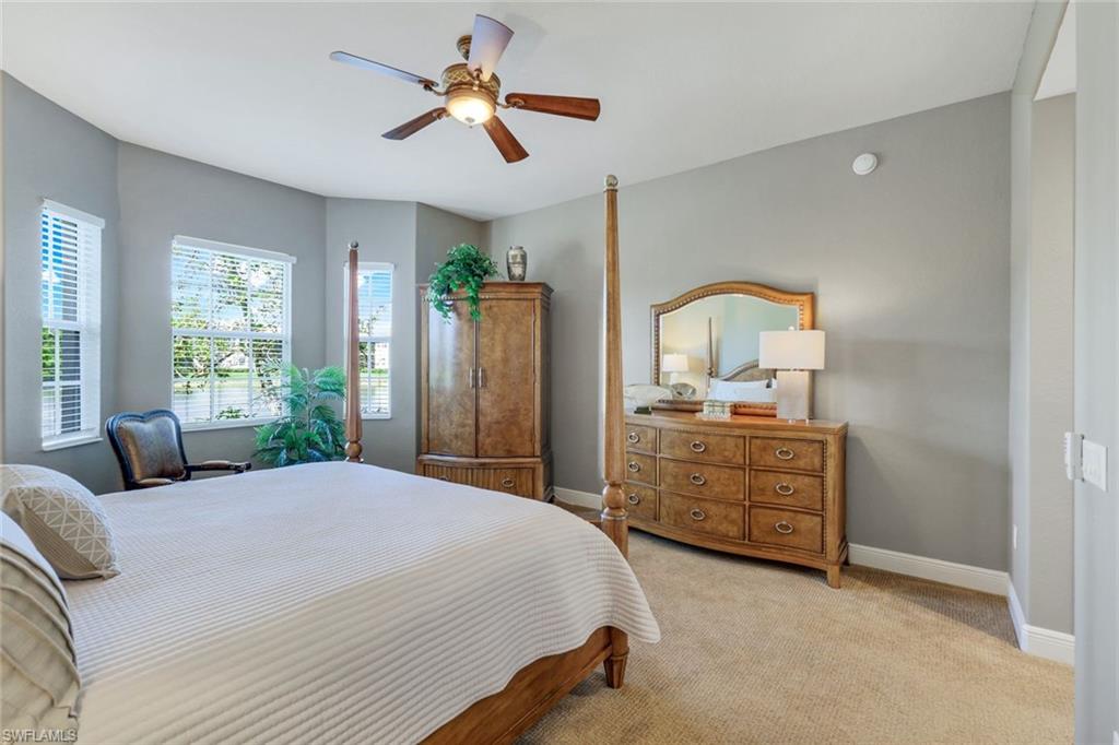 19620 Marino Lake Circle, Unit 2802 Fort Myers, FL 33913 - Photo 11 of 38 Bedroom with baseboards, ceiling fan, and light carpet
