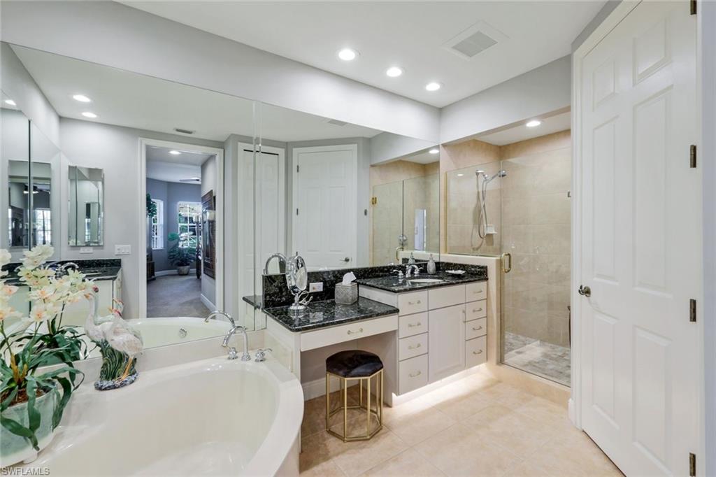 19620 Marino Lake Circle, Unit 2802 Fort Myers, FL 33913 - Photo 13 of 38 Bathroom featuring a garden tub, vanity, recessed lighting, and a shower stall