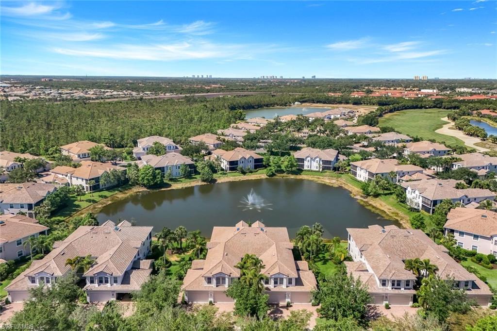 19620 Marino Lake Circle, Unit 2802 Fort Myers, FL 33913 - Photo 33 of 38 Drone / aerial view with a water view, golf course view, and a residential view
