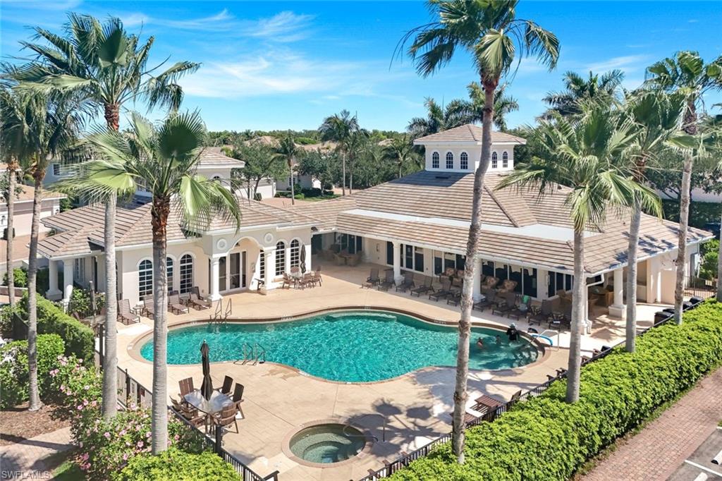 19620 Marino Lake Circle, Unit 2802 Fort Myers, FL 33913 - Photo 35 of 38 Pool featuring a patio, a community hot tub, and french doors