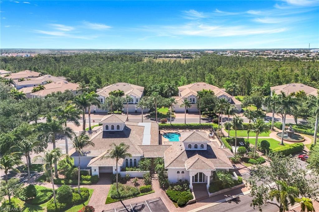 19620 Marino Lake Circle, Unit 2802 Fort Myers, FL 33913 - Photo 37 of 38 Birds eye view of property with a residential view and a forest view